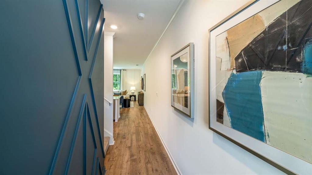3568 Matthew Court Decatur, GA 30030 - Photo 3 of 30 a hallway with a large window and wooden floor