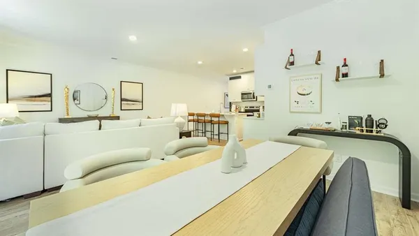 a living room with furniture and a table