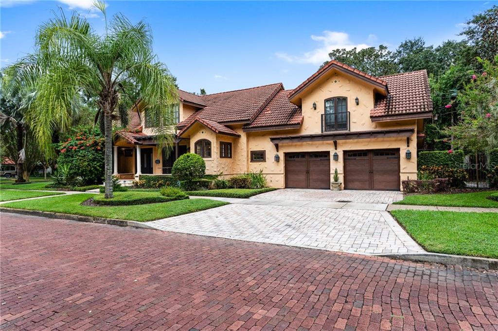 737 Springdale Road Orlando, FL 32804 - Photo 1 of 1 a front view of a house with a yard and garage