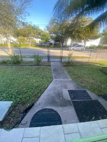 a view of a yard and an trees