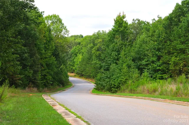 an aerial view of a house with mountain view