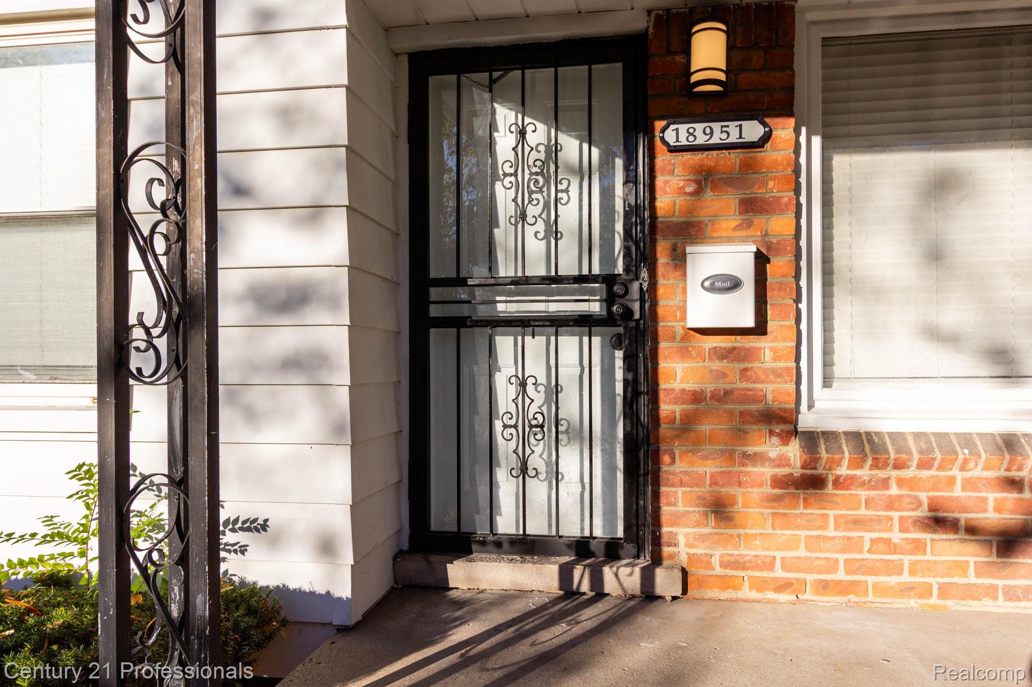 18951 Edinborough Road Detroit, MI 48219 - Photo 4 of 47 Doorway to property featuring brick siding
