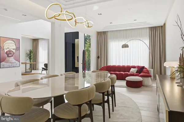 a bedroom with furniture and a large window