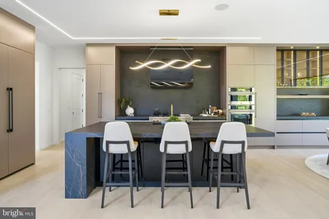 a kitchen with a stove and a refrigerator