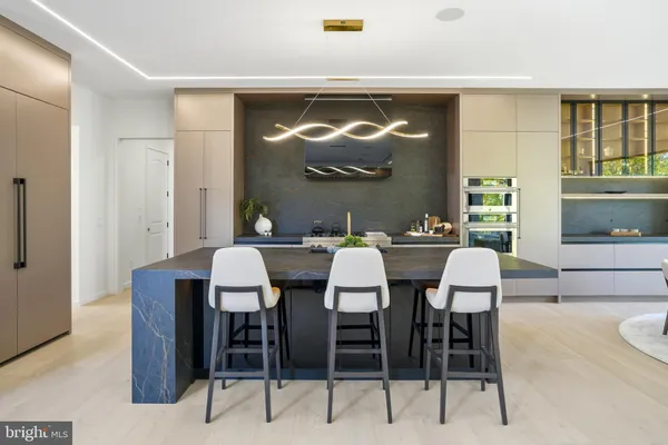 a kitchen with a stove and a refrigerator