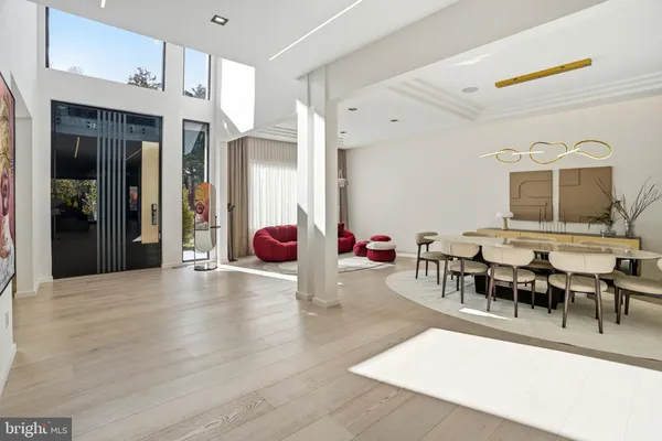 a view of living room with furniture and a fireplace