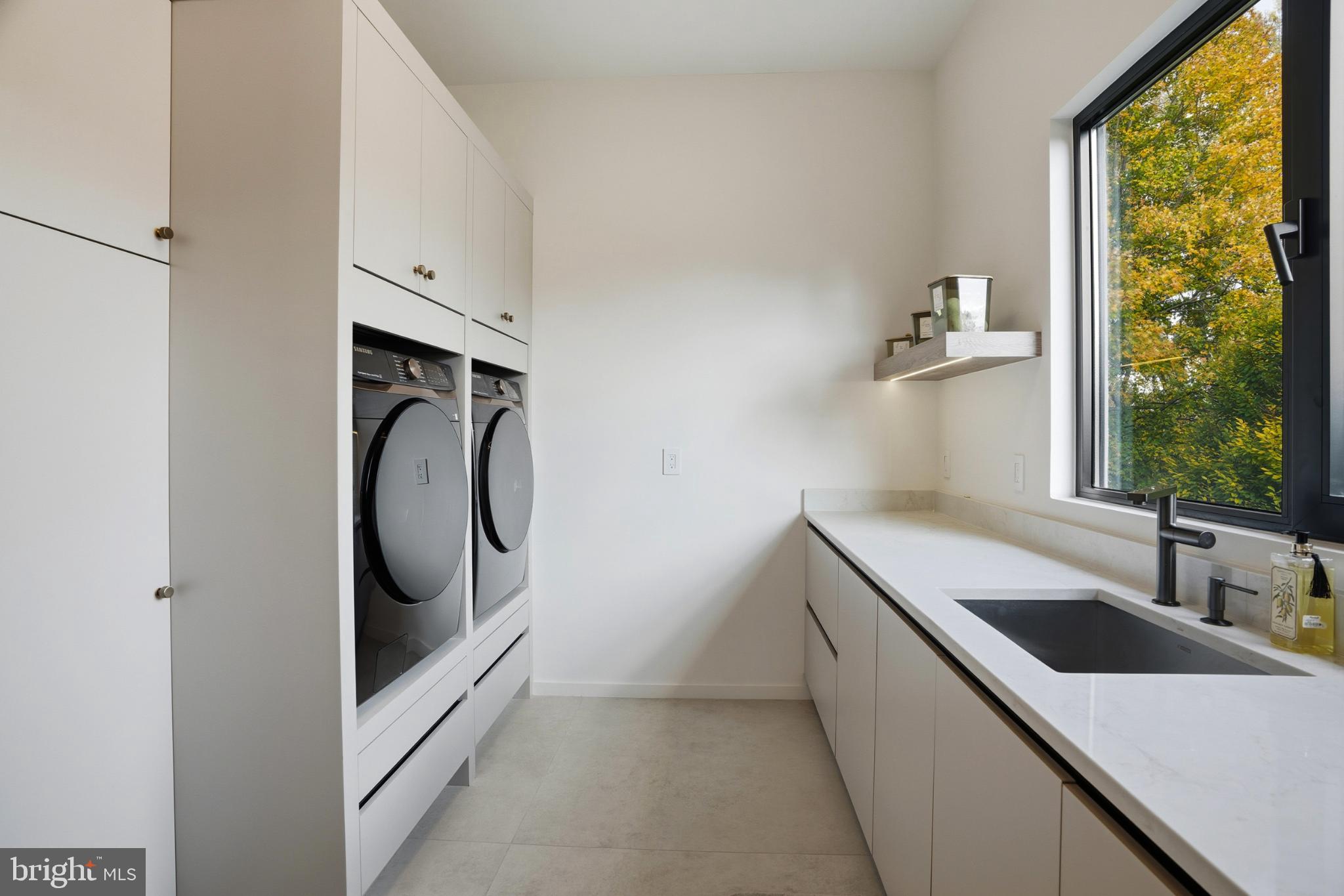 9408 Old Courthouse Road Vienna, VA 22182 - Photo 42 of 92 Sleek laundry room with modern finishes.