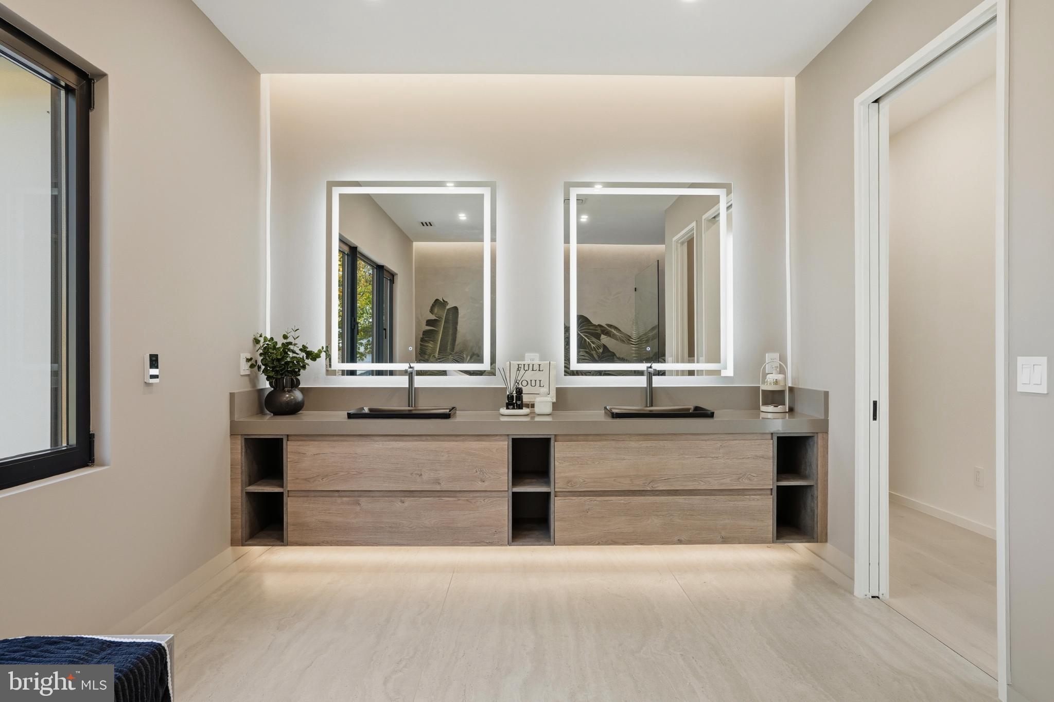9408 Old Courthouse Road Vienna, VA 22182 - Photo 54 of 92 Sleek modern bathroom with dual vanities.