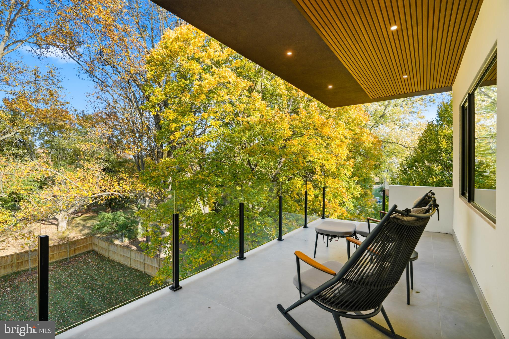9408 Old Courthouse Road Vienna, VA 22182 - Photo 57 of 92 Serene balcony with vibrant autumn views.