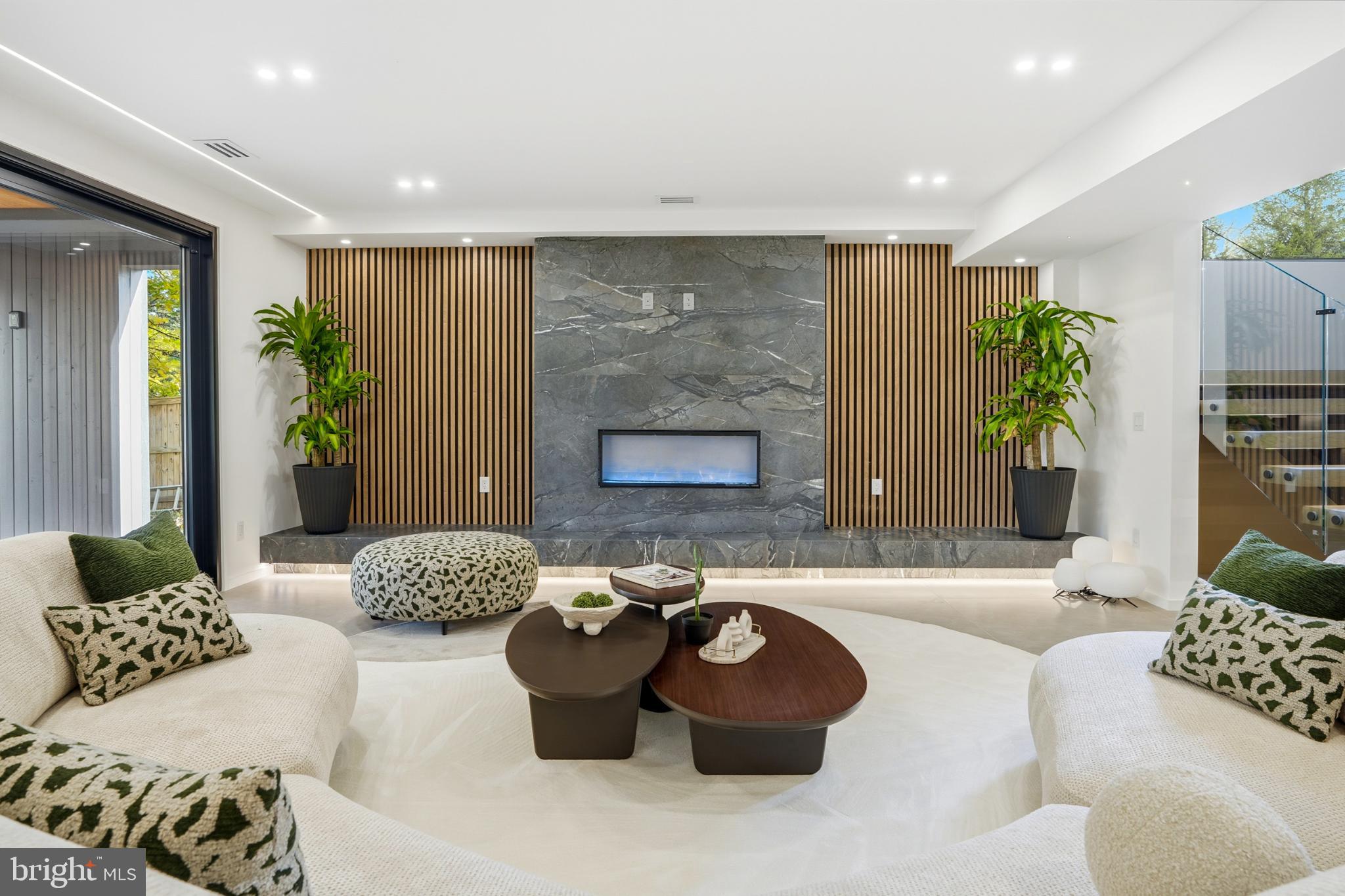 9408 Old Courthouse Road Vienna, VA 22182 - Photo 70 of 92 a living room with furniture potted plant and a fireplace