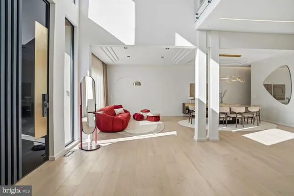 a dining room with furniture and wooden floor
