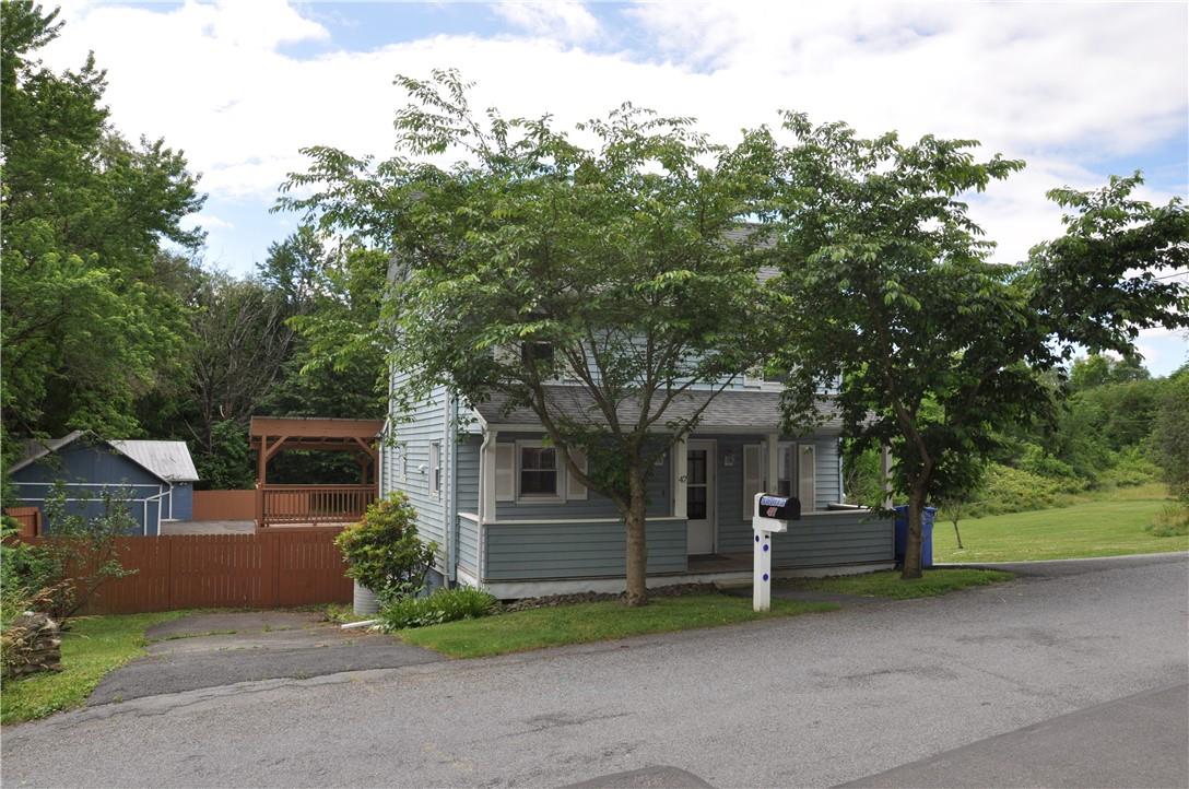 47 Jayne Street Florida, NY 10921 - Photo 1 of 1 a front view of a house with a garden and trees