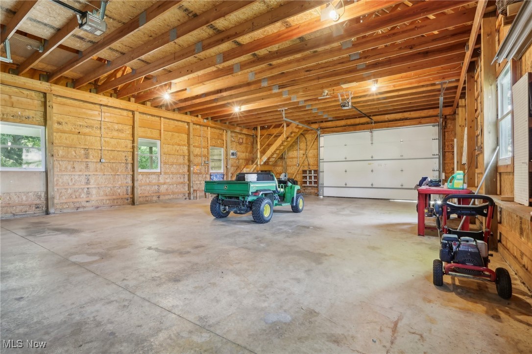 36155 Kinzel Road Avon, OH 44011 - Photo 29 of 38 Front lift door on barn, 2 separate man doors, water and electicity