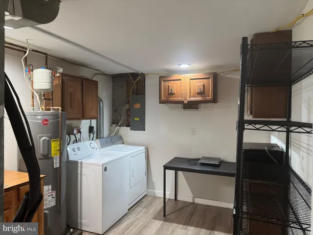 a kitchen with a sink appliances and cabinets
