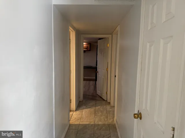 a view of a hallway with a closet