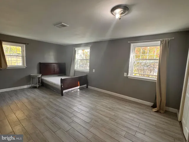 a living room with furniture and windows