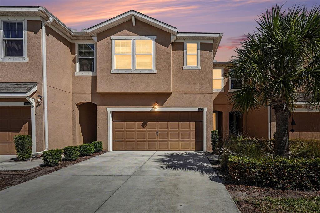 10210 Newel Valley Loop Riverview, FL 33569 - Photo 24 of 30 a front view of a house with a yard and garage