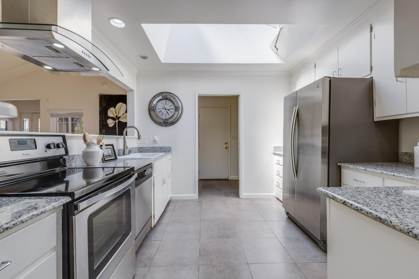 1253 Pomeroy Avenue Santa Clara, CA 95051 - Photo 6 of 17 a kitchen with stainless steel appliances granite countertop a stove a refrigerator and a oven
