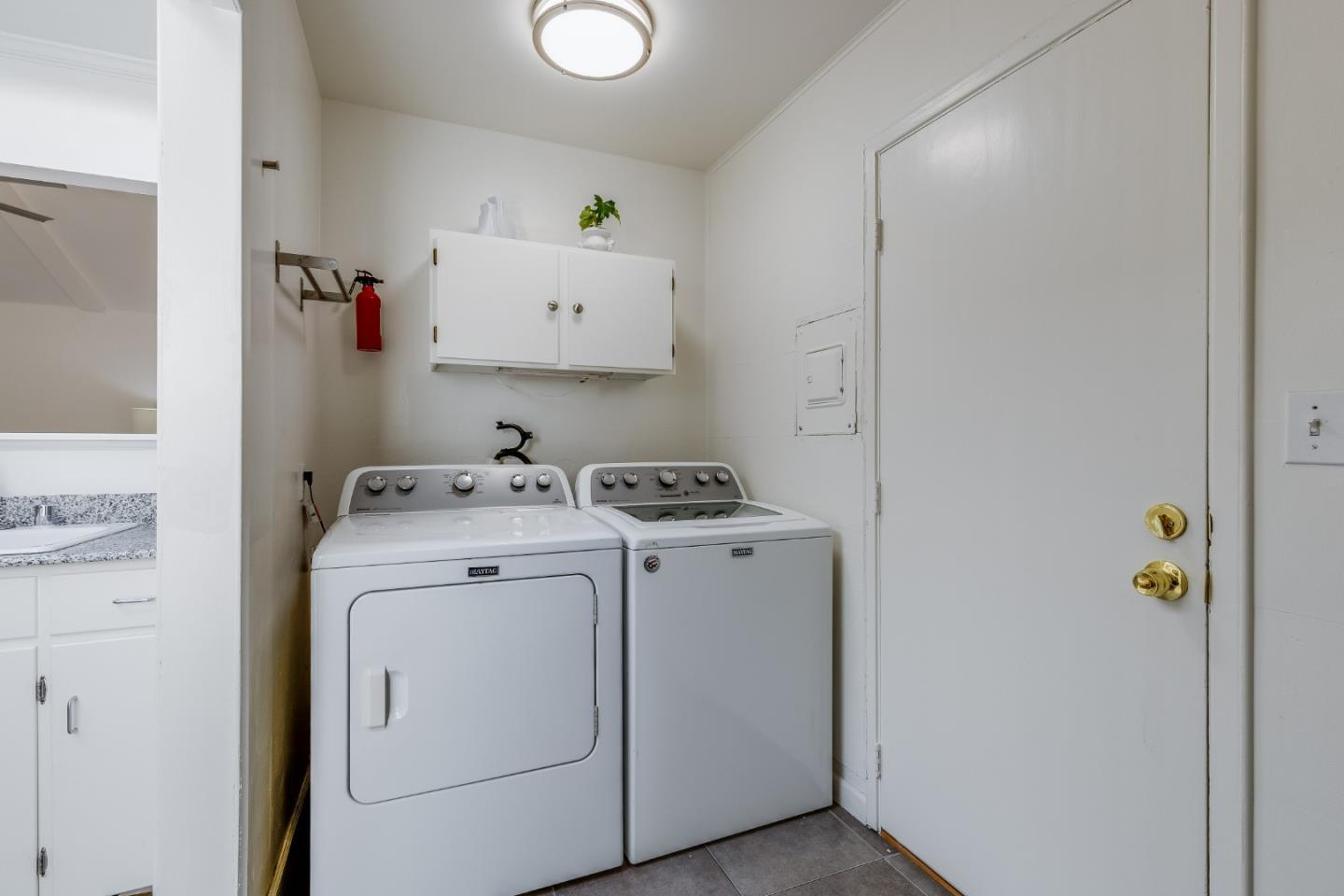 1253 Pomeroy Avenue Santa Clara, CA 95051 - Photo 9 of 17 a view of storage and utility room with washer and dryer