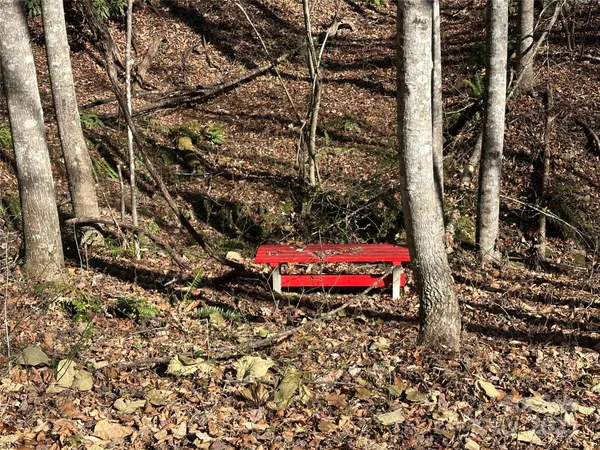 a bench is sitting in the middle of a red building