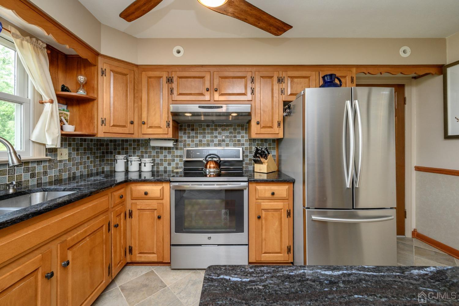 119 Mt Grove Road Califon, NJ 07830 - Photo 12 of 40 a kitchen with stainless steel appliances granite countertop a refrigerator and a stove