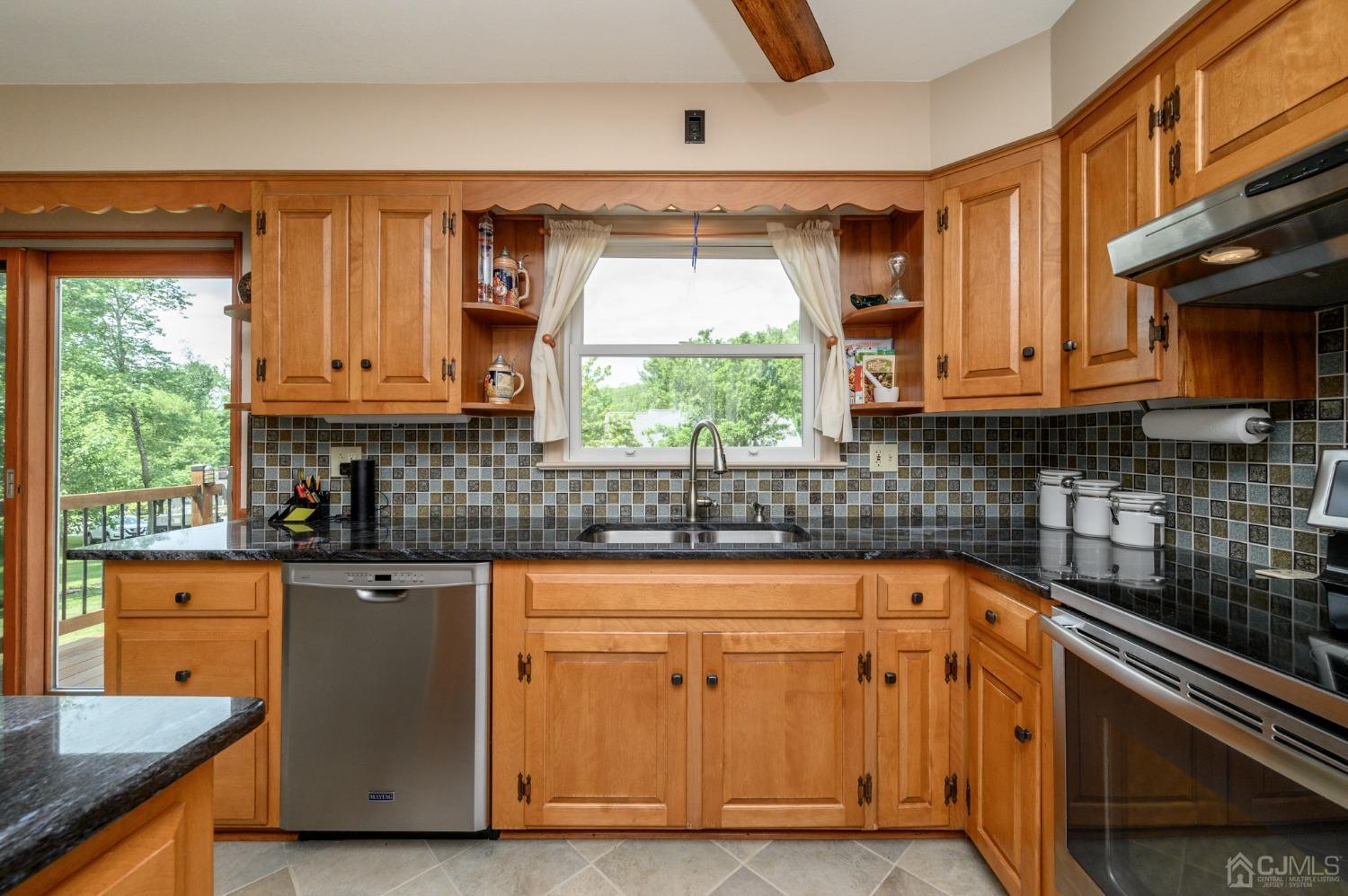 119 Mt Grove Road Califon, NJ 07830 - Photo 13 of 40 a kitchen with granite countertop a sink window and cabinets
