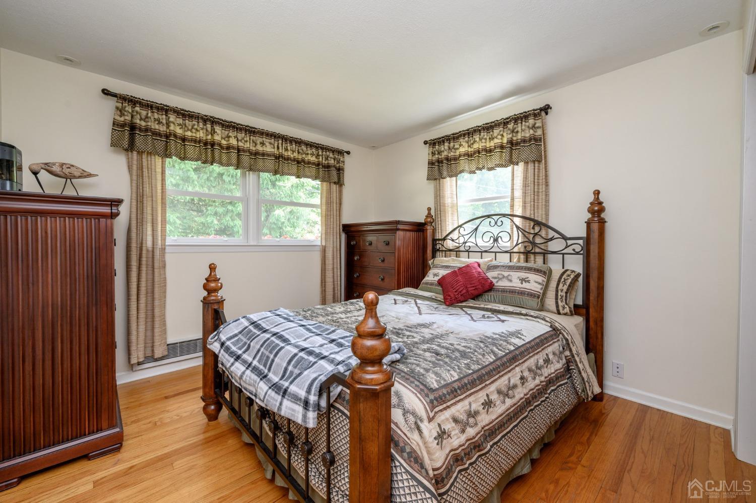 119 Mt Grove Road Califon, NJ 07830 - Photo 20 of 40 a bedroom with a bed and wooden floor