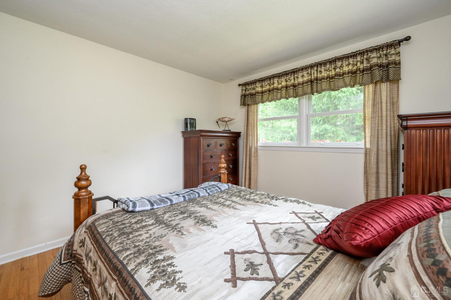 119 Mt Grove Road Califon, NJ 07830 - Photo 21 of 40 a bed sitting in a bedroom next to a window