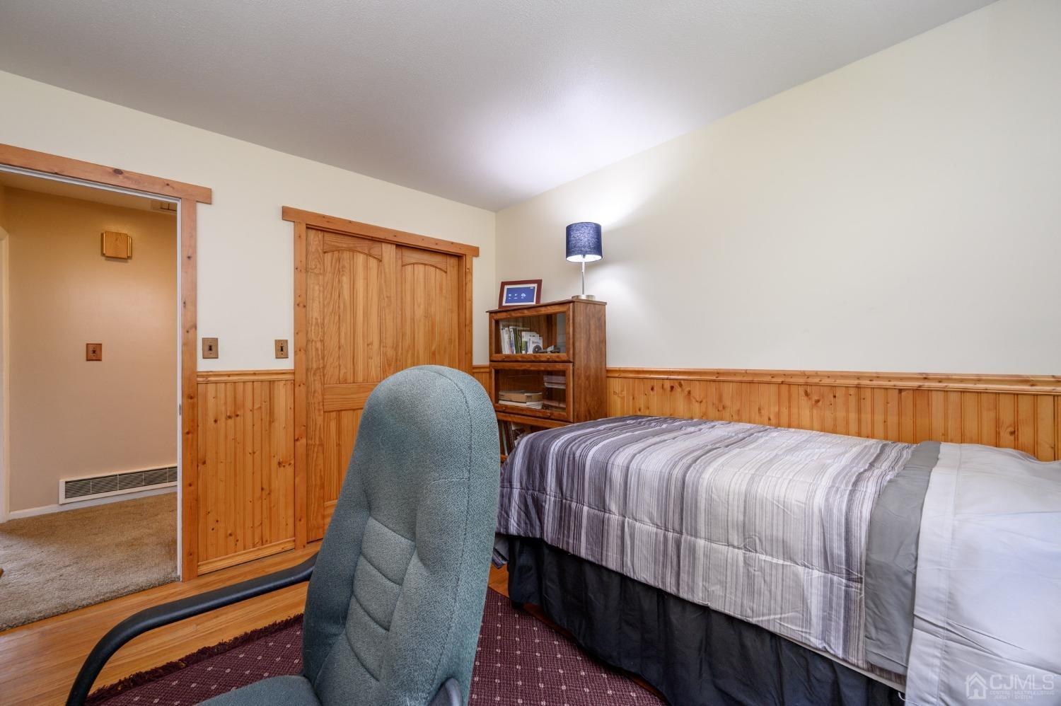 119 Mt Grove Road Califon, NJ 07830 - Photo 24 of 40 a bedroom with a bed and wooden floor