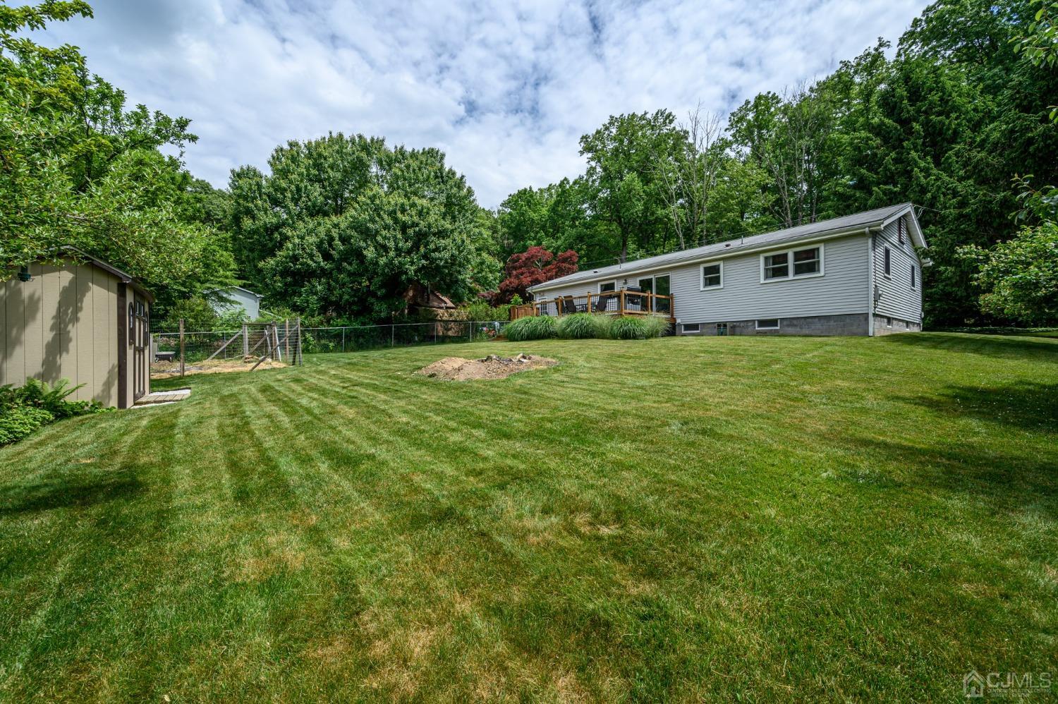 119 Mt Grove Road Califon, NJ 07830 - Photo 34 of 40 a house with green field in front of it
