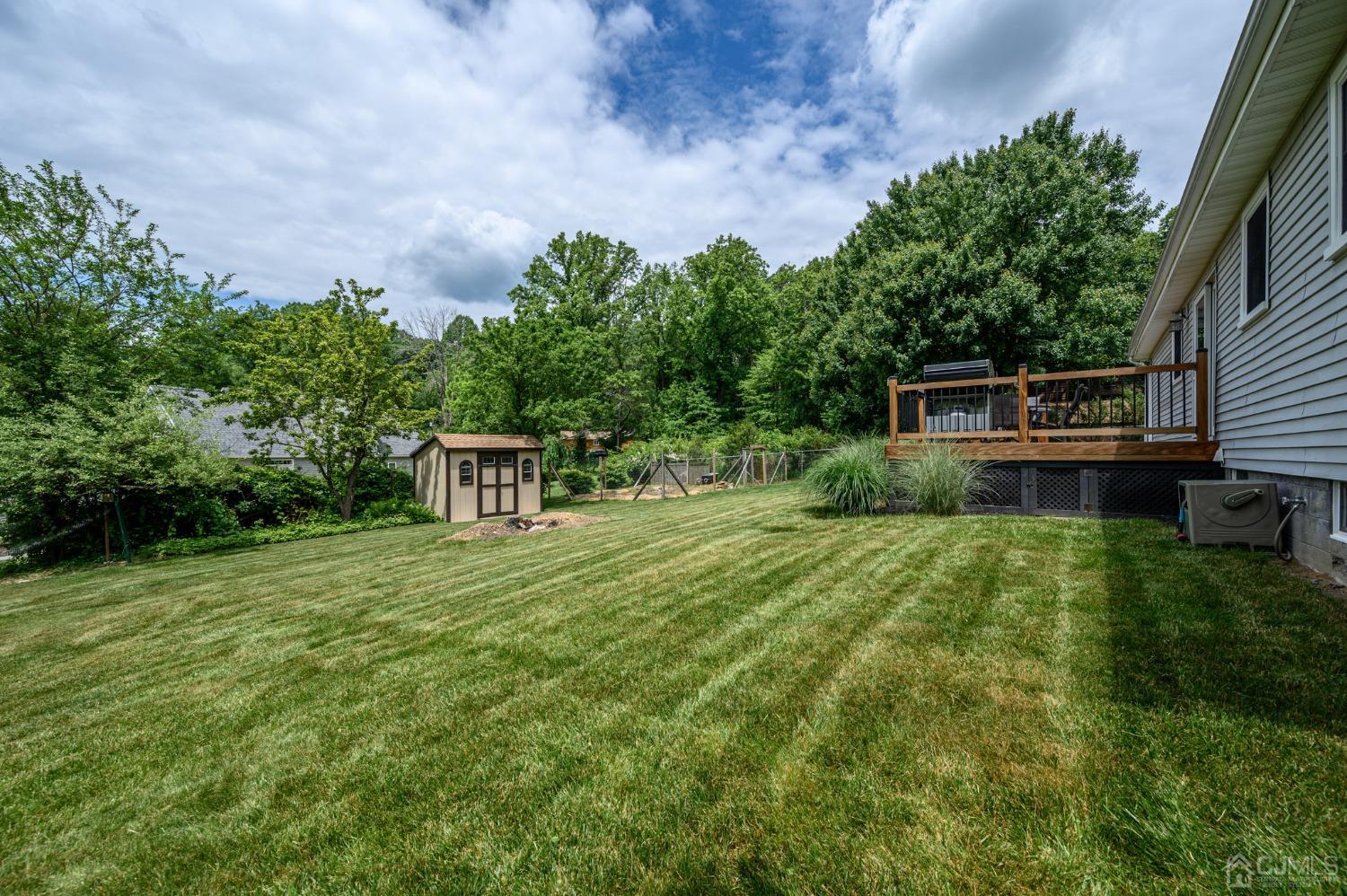 119 Mt Grove Road Califon, NJ 07830 - Photo 35 of 40 a backyard of a house with plants and large trees