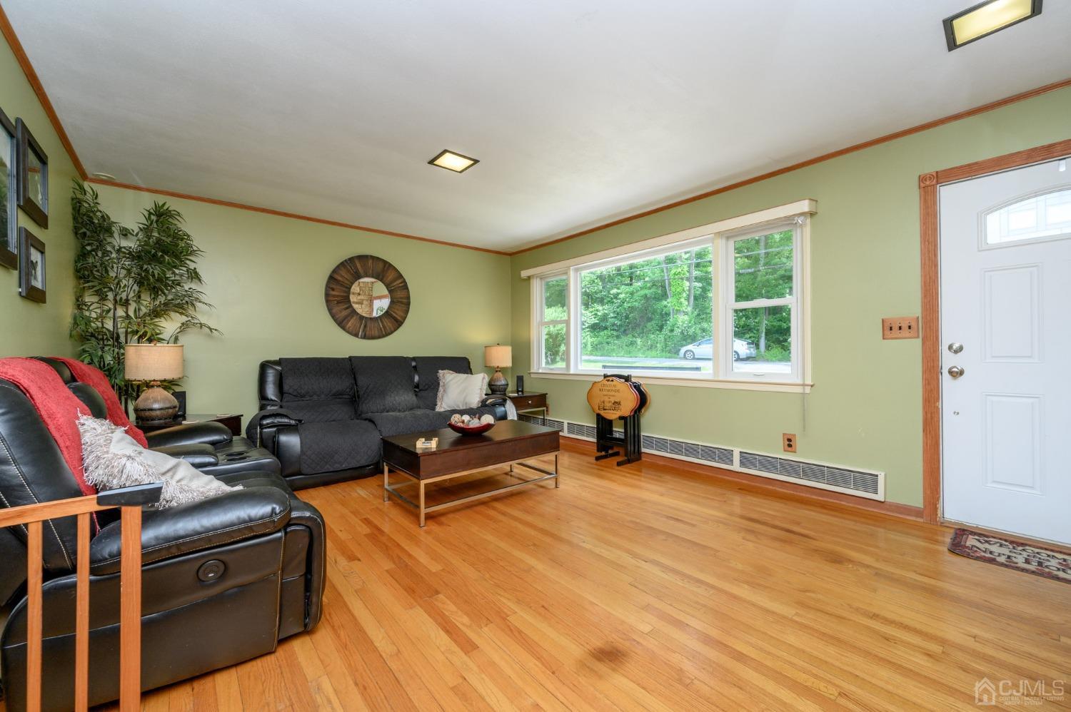 119 Mt Grove Road Califon, NJ 07830 - Photo 5 of 40 a living room with furniture a window and wooden floor