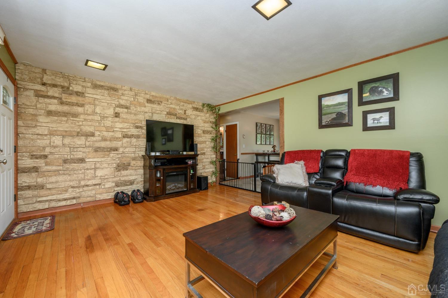 119 Mt Grove Road Califon, NJ 07830 - Photo 6 of 40 a living room with furniture and a flat screen tv