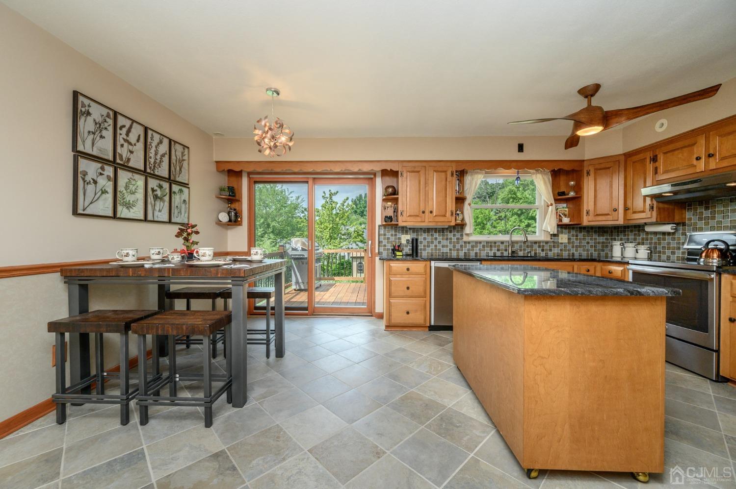 119 Mt Grove Road Califon, NJ 07830 - Photo 9 of 40 a kitchen with granite countertop a sink and a stove