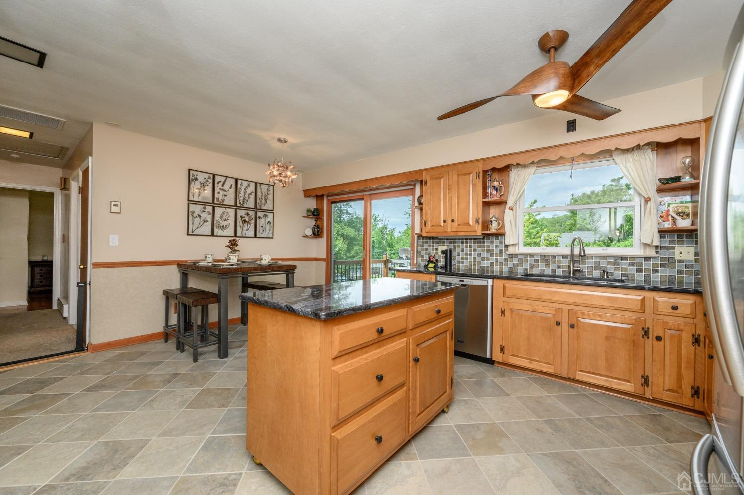 119 Mt Grove Road Califon, NJ 07830 - Photo 10 of 40 a kitchen with stainless steel appliances granite countertop a stove a sink and a refrigerator