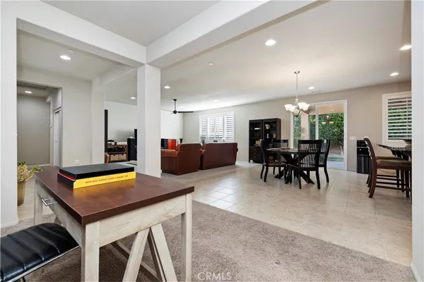 a large kitchen with a table and chairs