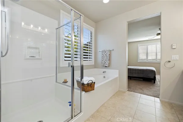 a bathroom with a tub a sink and a shower