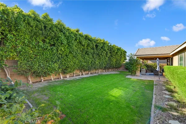 a view of house with backyard