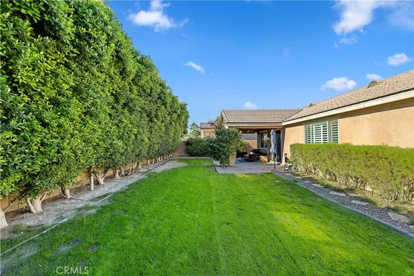 a view of house with backyard