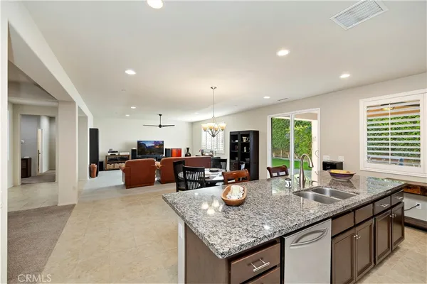 a kitchen with sink stove and cabinets