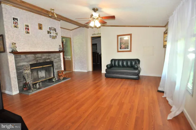 a living room with a couch and a fireplace