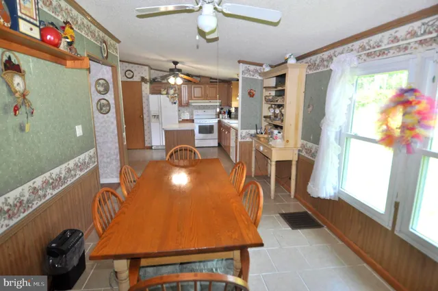 a view of a livingroom with furniture and a window