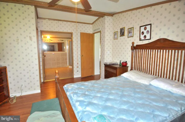 a bedroom with a bed and a rug