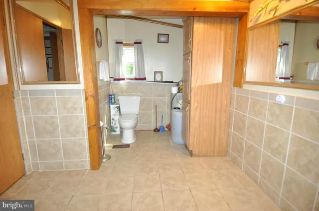 a view of a bathroom with a sink and a mirror