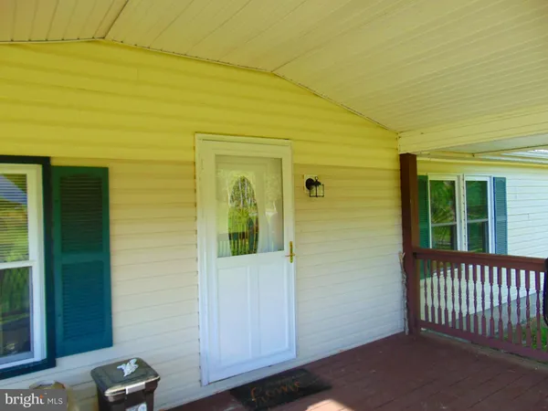 a view of a porch of a house