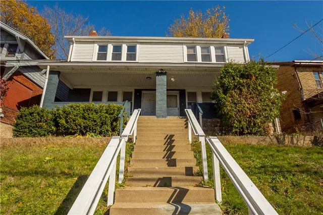 a view of house with swimming pool