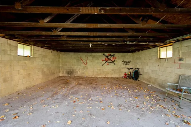 a view of a empty room with a wooden floor
