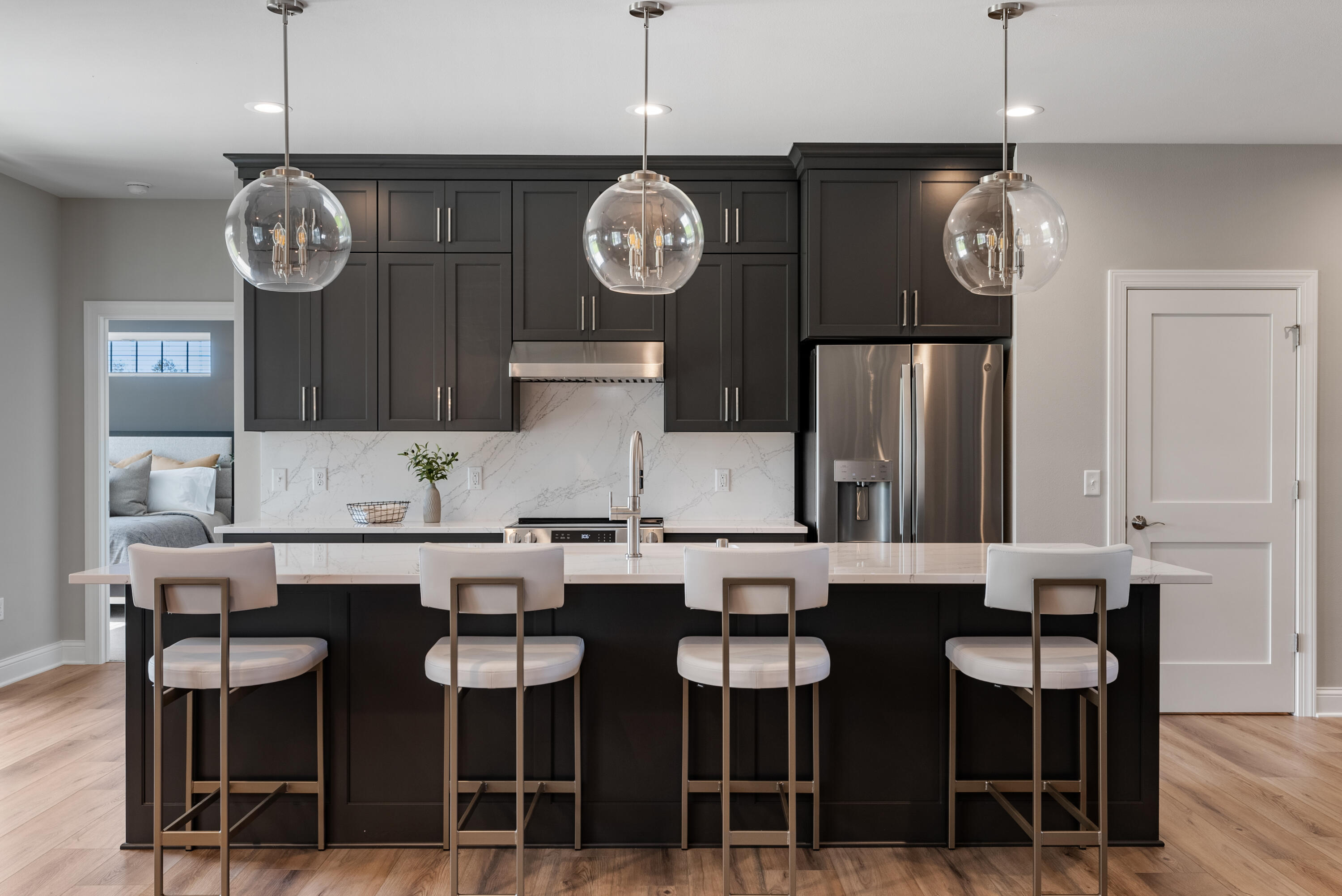 1749 North River Road Milwaukee, WI 53217 - Photo 8 of 40 Gorgeous quartz island and backsplash