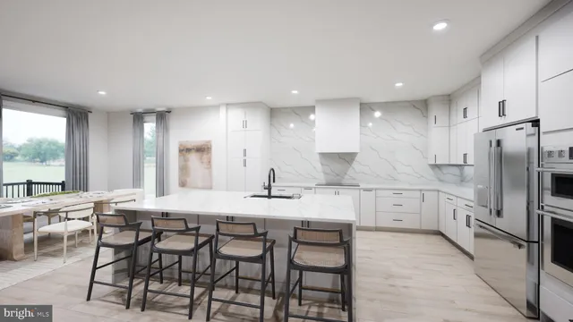 a kitchen with sink and view of living room