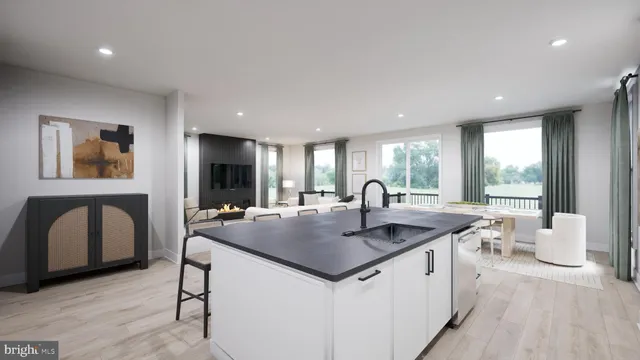 a large kitchen with a table and chairs